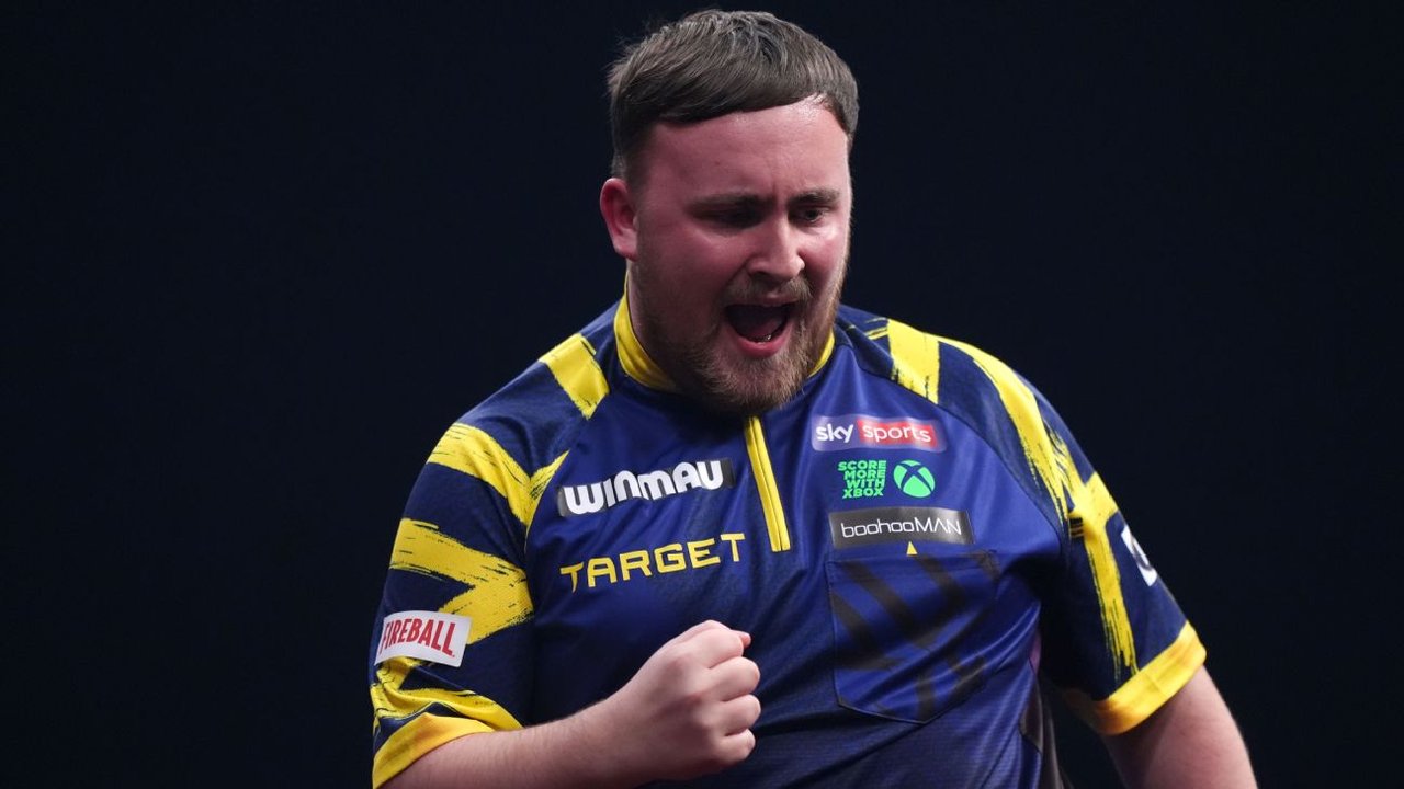 Luke Littler competing in darts