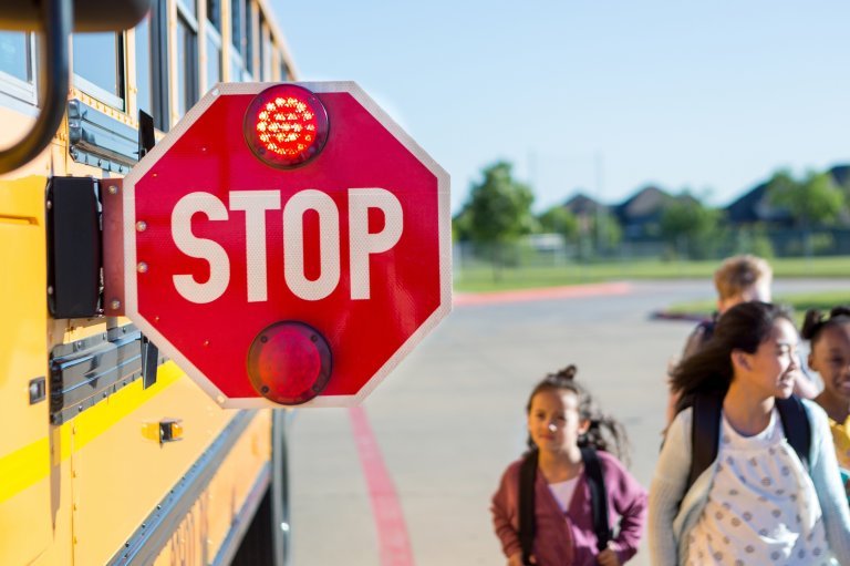 Waymo autonomous vehicle near a school bus — Austin documented 19 cases of self-driving Waymo robotaxis illegally passing school buses