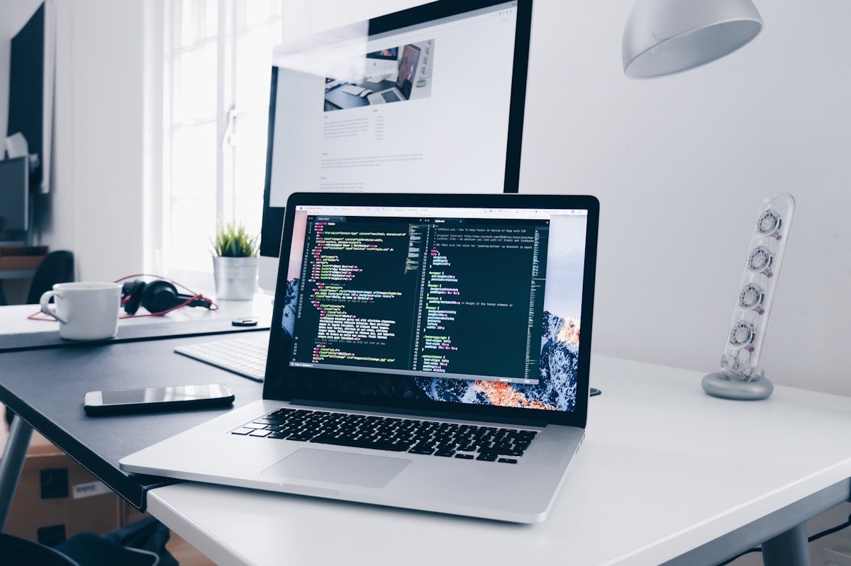 Developer at laptop illustrating AI automation's impact on programmer employment since ChatGPT launched in 2022