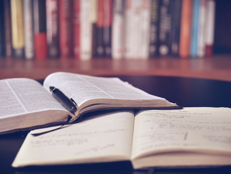 Researcher manually verifying AI-generated paper citations before ArXiv submission to avoid 1-year ban